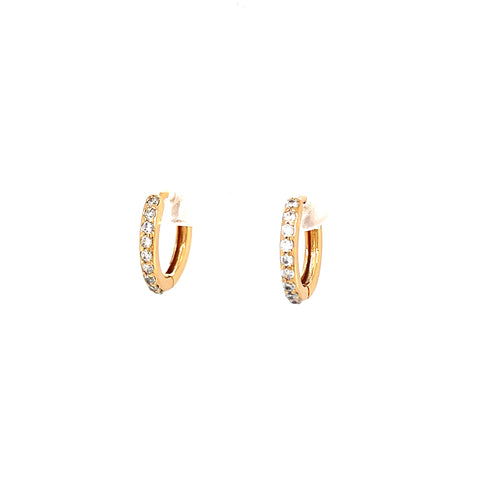A pair of Rose gold Zirconia stone huggie earrings displayed against a plain white background, showcasing their elegant and minimalist charm.